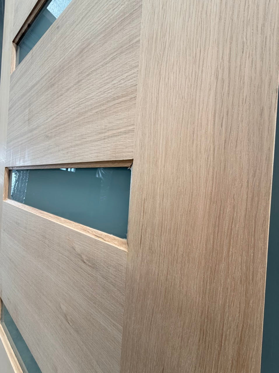 Close up of hardwood grain on Malibu timber entrance door