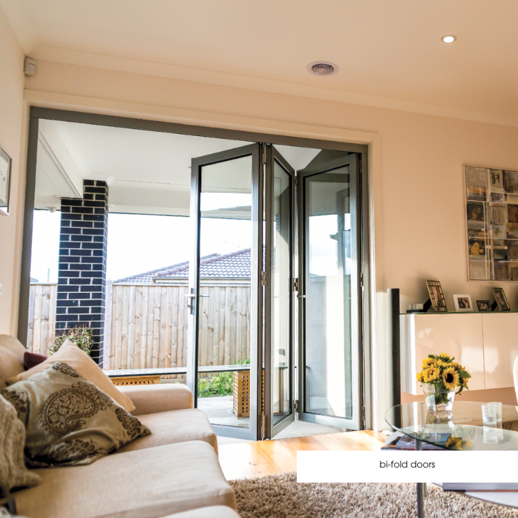 Double glazed aluminium bifold doors opening to outdoor patio