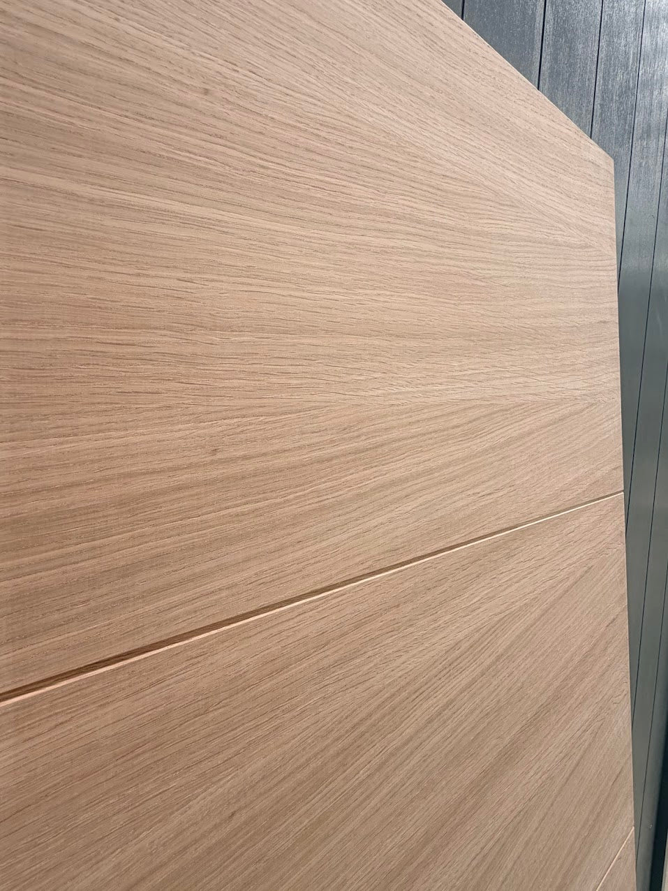 Close-up of a wooden panel with a visible grain pattern